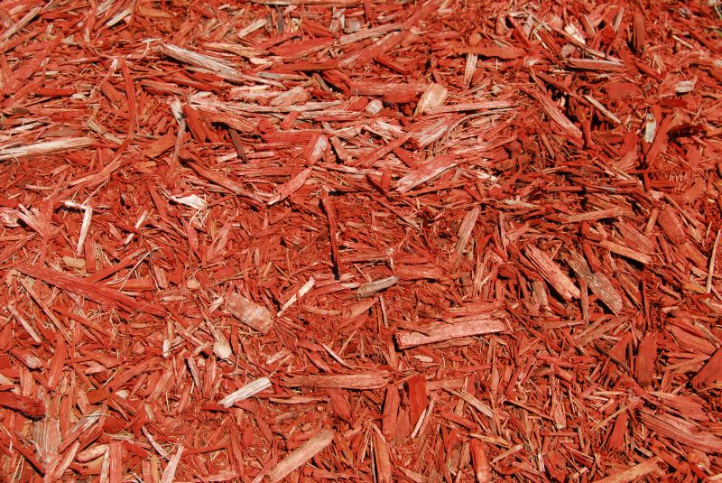 Red Mulch Spread in a Garden Bed